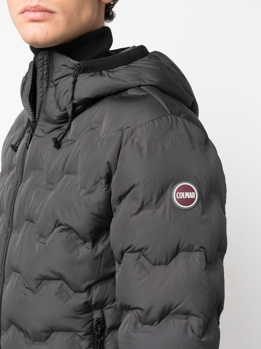 gray quilted down jacket