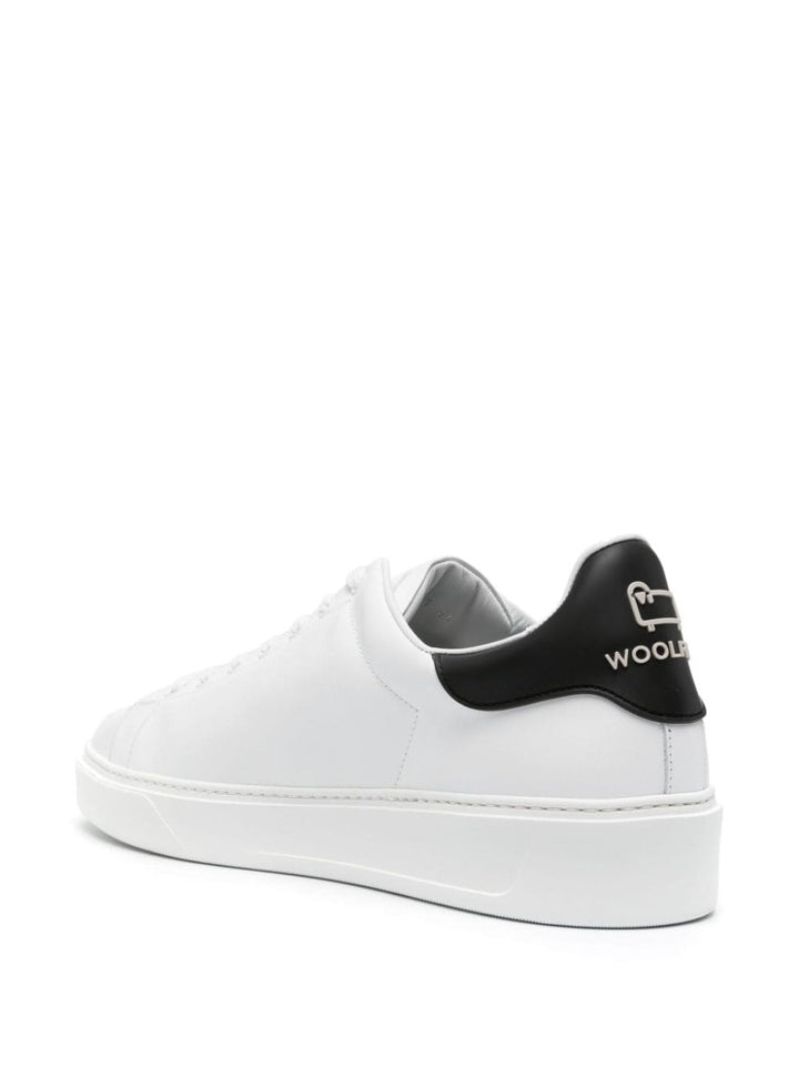 white sneaker with black heel