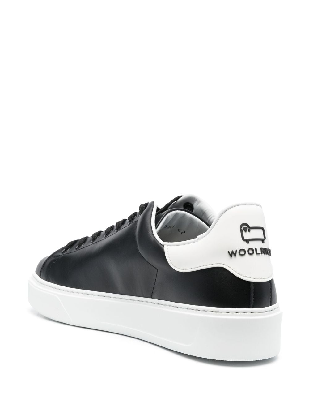 Black sneaker with white heel