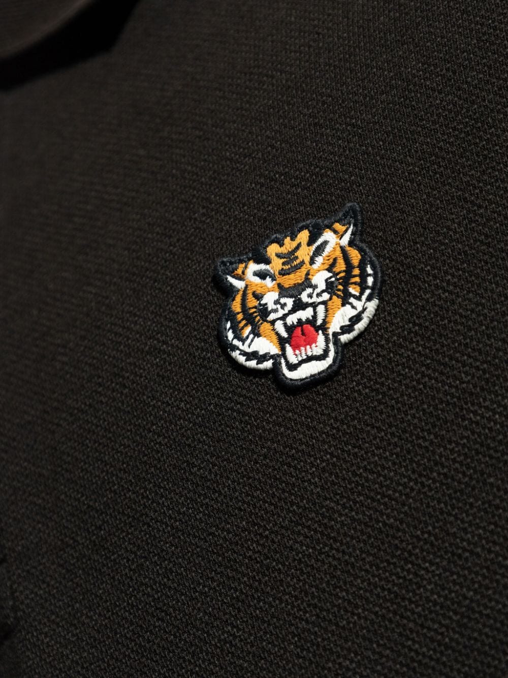 Polo nera logo tiger