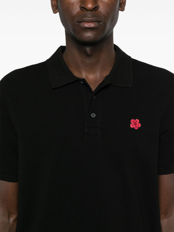 Polo nera logo rosso