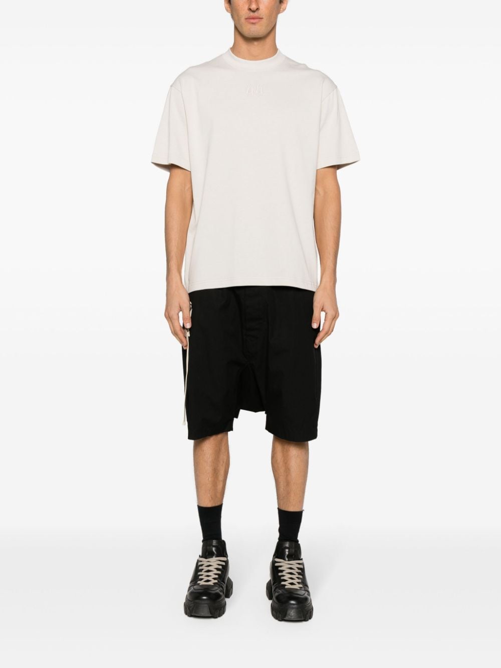 Dirty white t-shirt with black logo