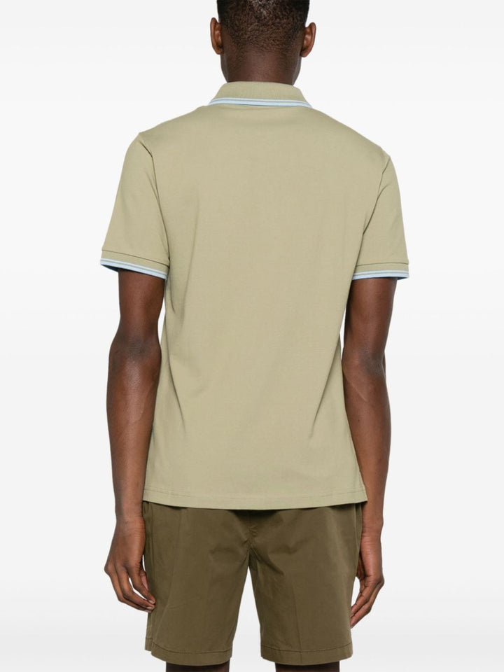Green polo shirt with piping