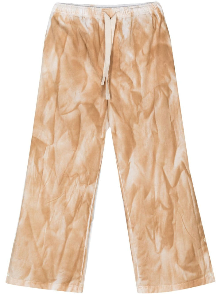 Beige trousers with tie dye pattern