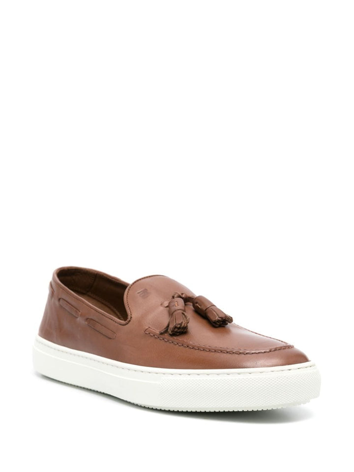 Brown leather moccasin with tassels