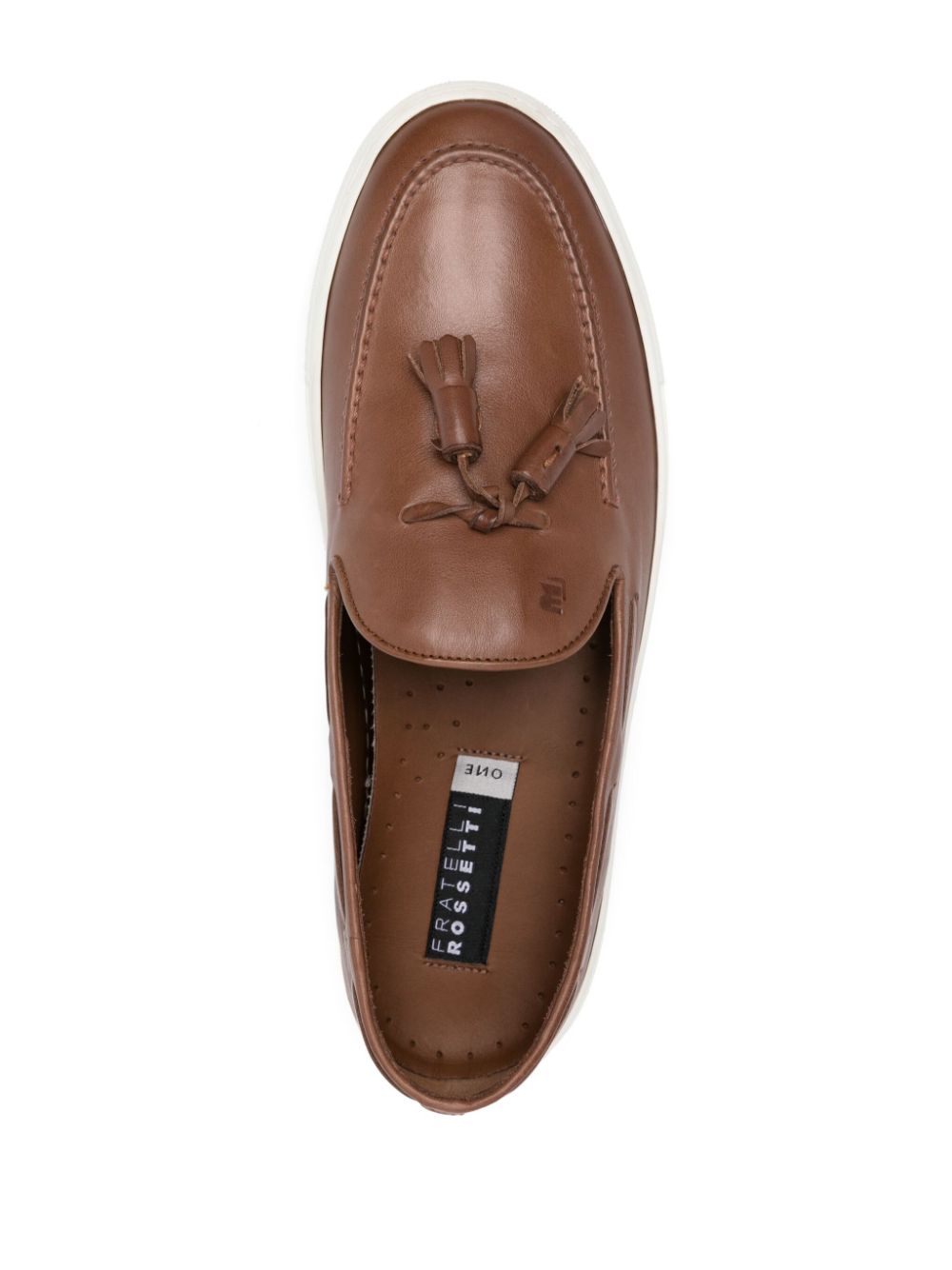 Brown leather moccasin with tassels