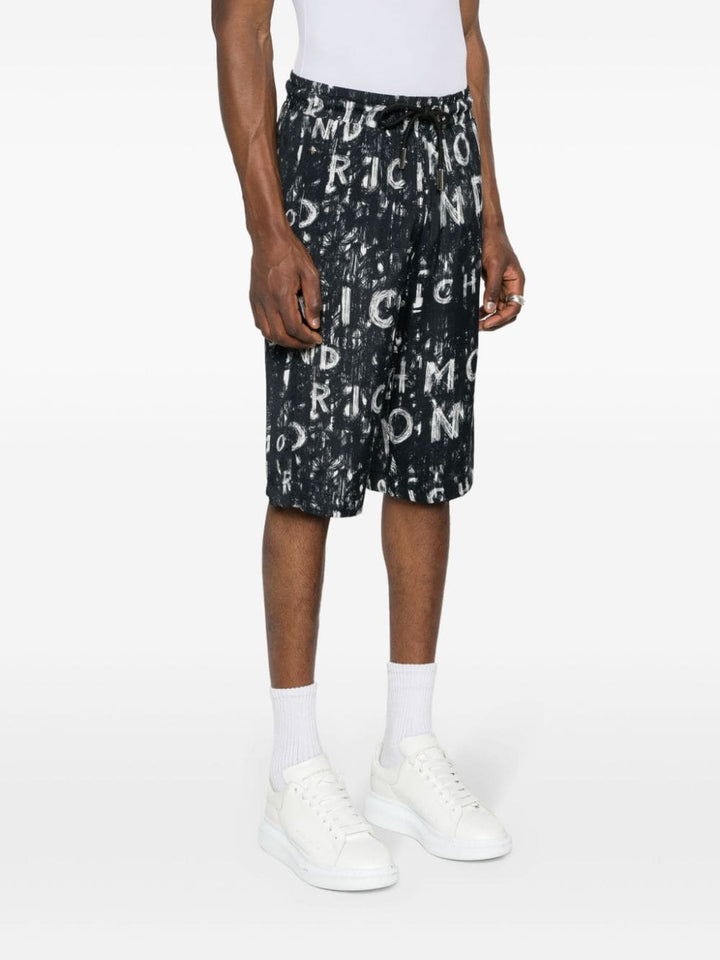 Black Bermuda shorts with all over print