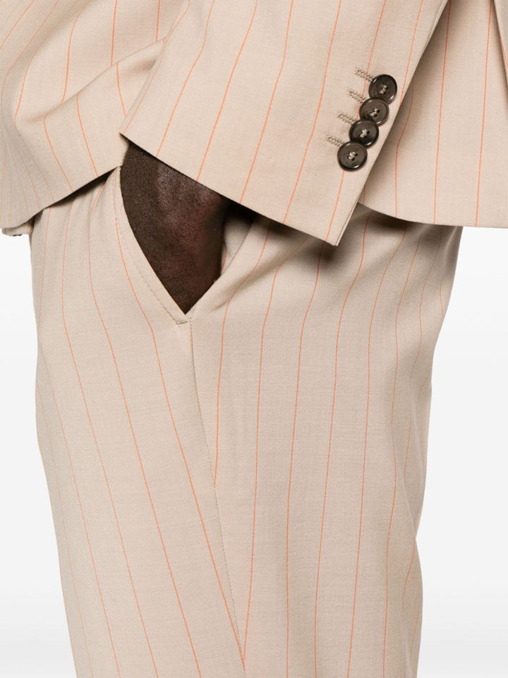 Beige double-breasted pinstriped suit