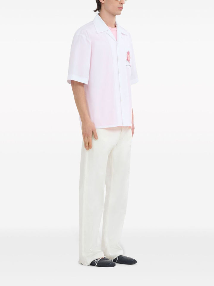 White shirt with flower application