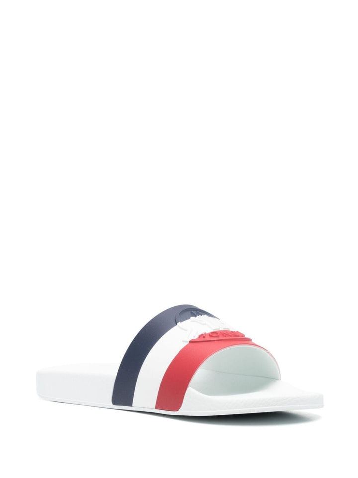 White slipper with multicolor logo