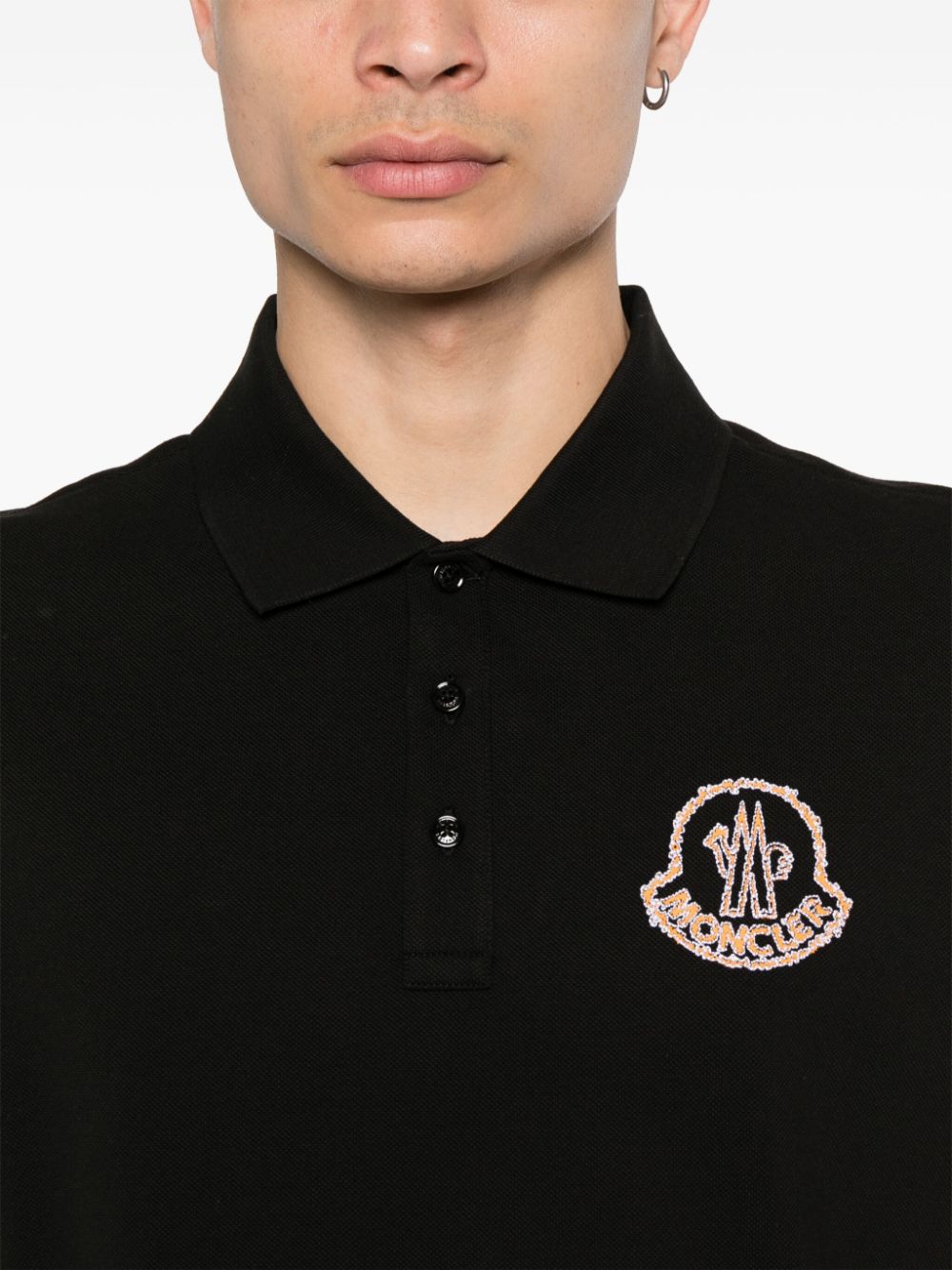 Black polo shirt with embroidered logo