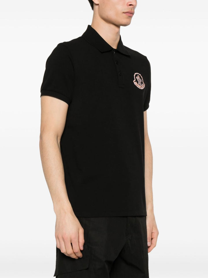 Black polo shirt with embroidered logo