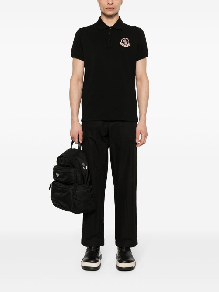 Black polo shirt with embroidered logo