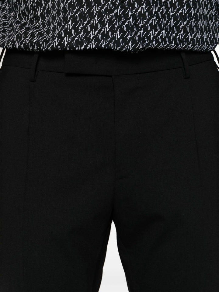 Ten black trousers