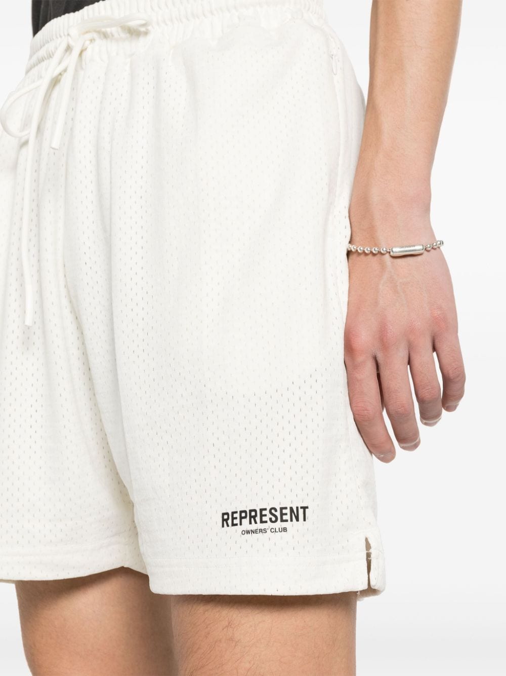White shorts with perforated design