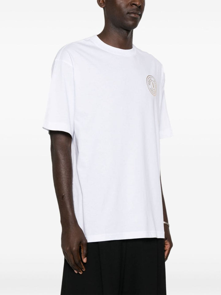 White t-shirt with gold logo