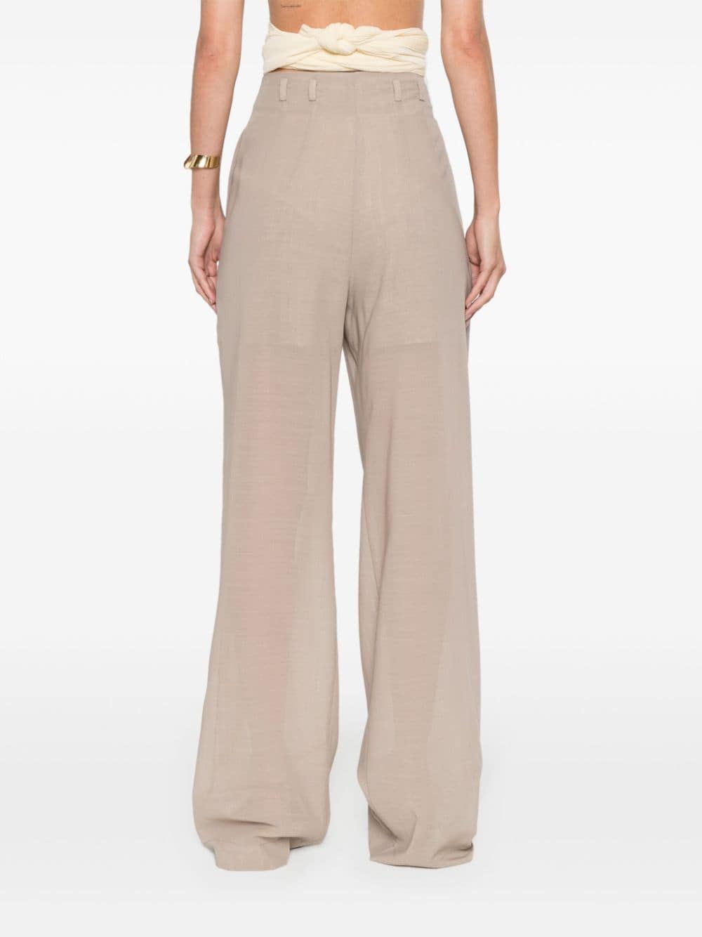 Semi-transparent trousers with crease