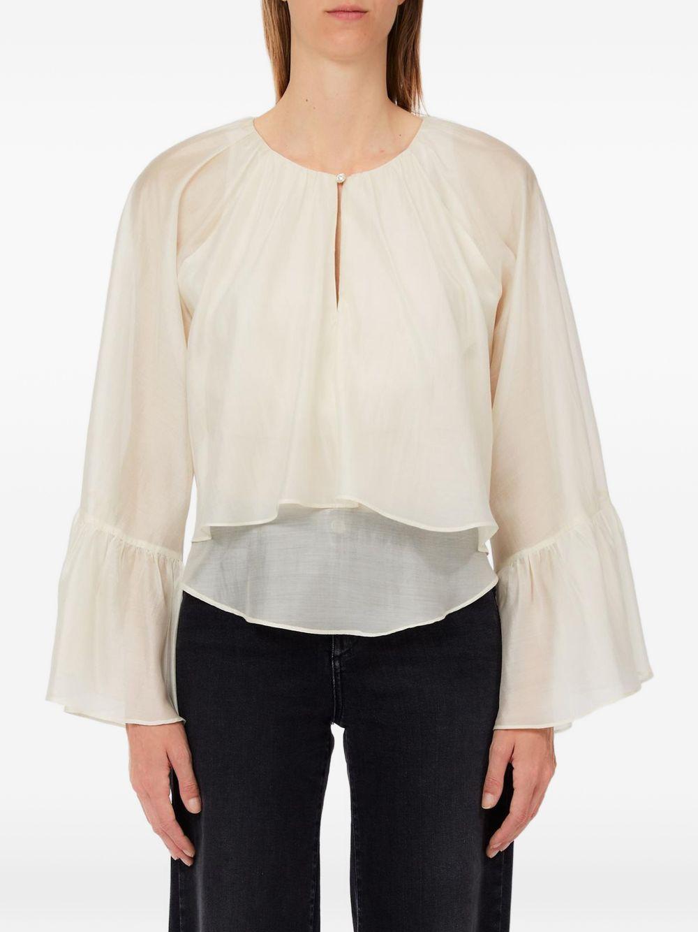Blusa con maniche ampie 