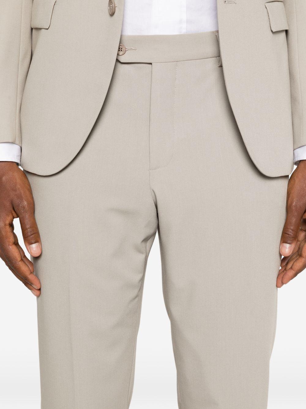 Abito beige monopetto con rever a punta 