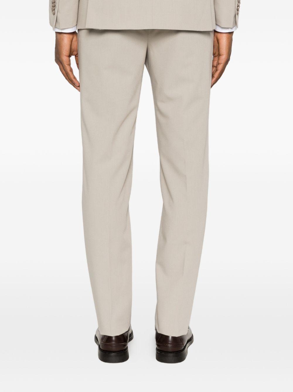 Abito beige monopetto con rever a punta 