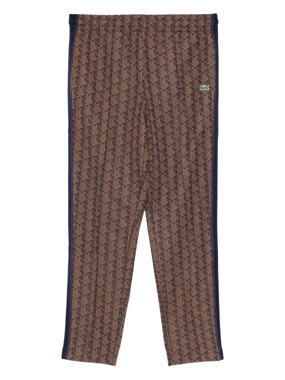 Pantaloni marrone scuro con applicazione logo 