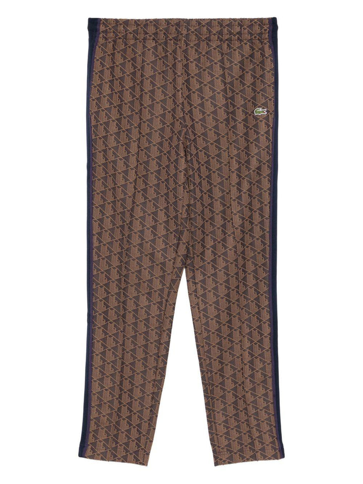 Pantaloni marrone scuro con applicazione logo 