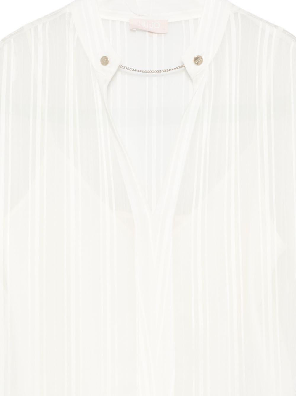 Blusa con scollo a V 