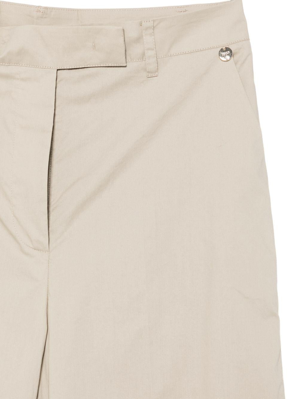 Pantaloni con logo e placca 