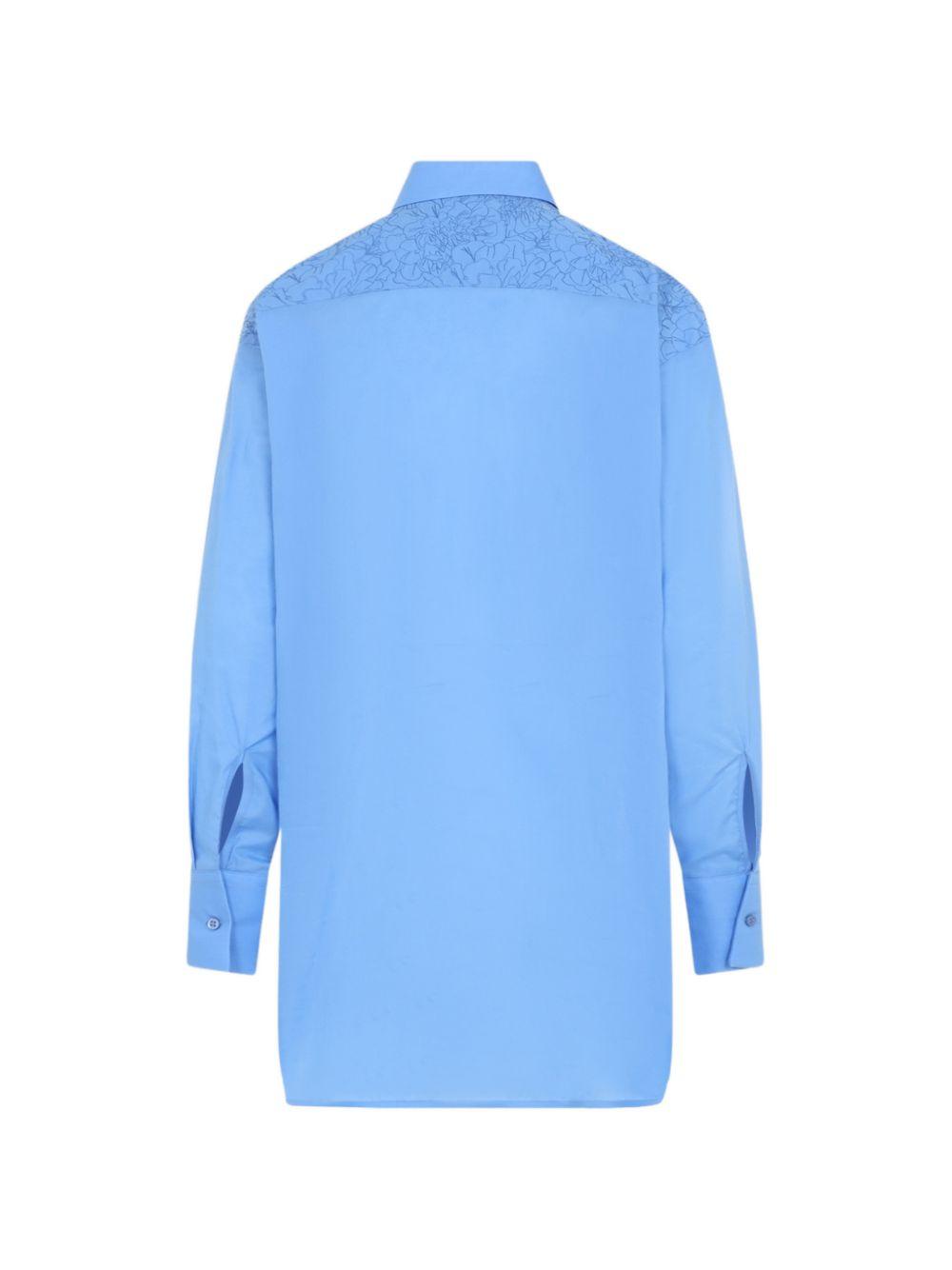 Camicia con applicazioni floreali 