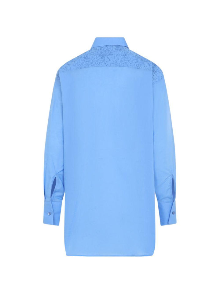 Camicia con applicazioni floreali 