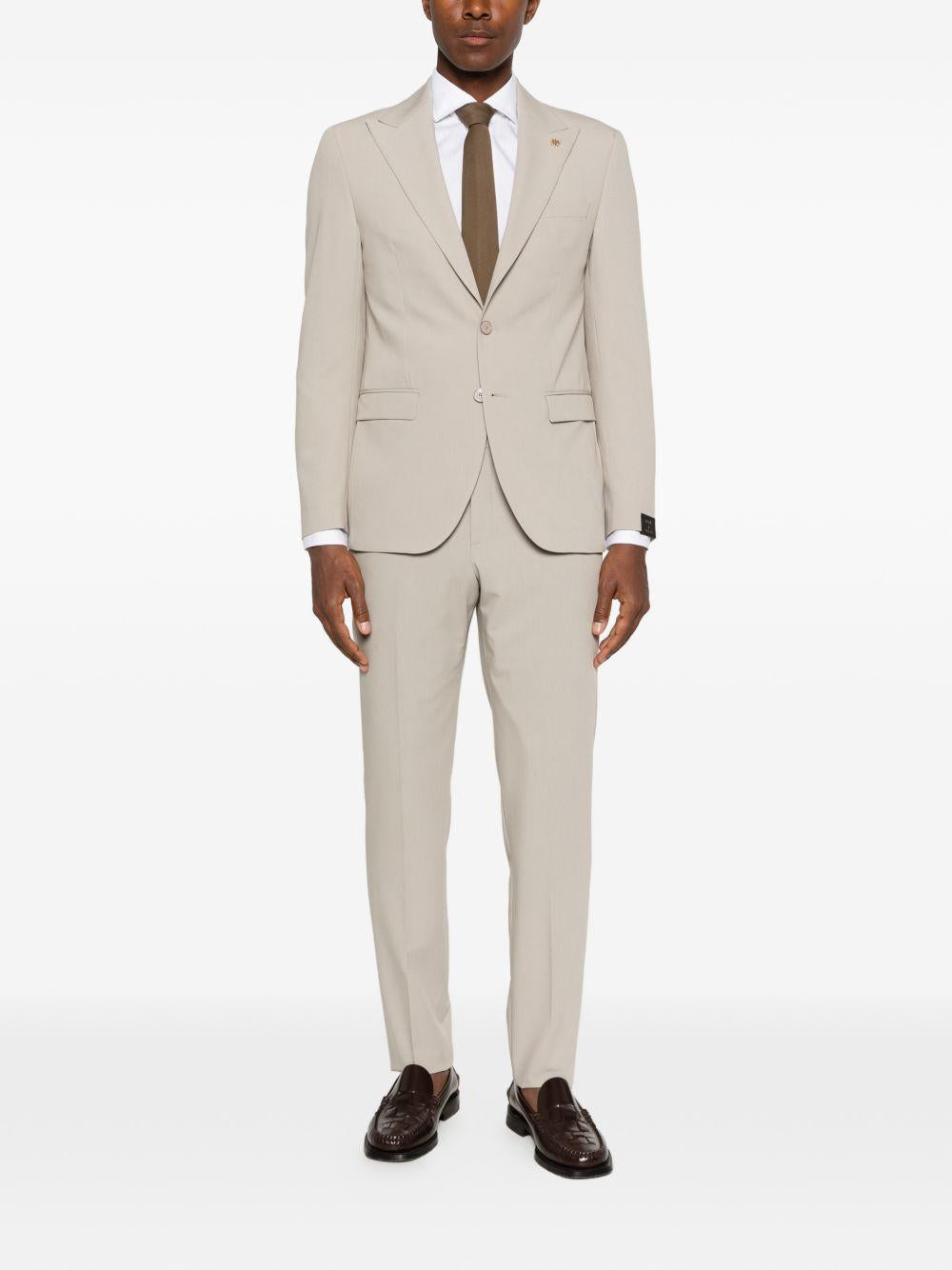 Abito beige monopetto con rever a punta 