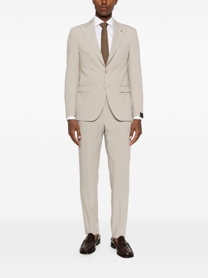 Abito beige monopetto con rever a punta 