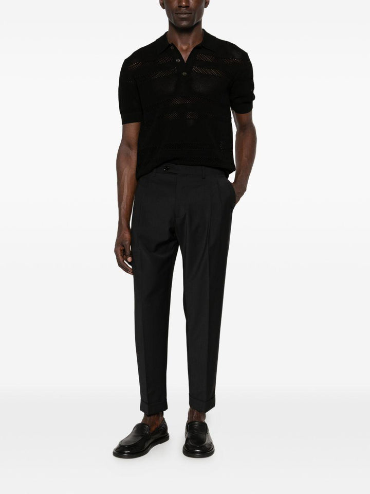 Pantaloni neri con risvolto 