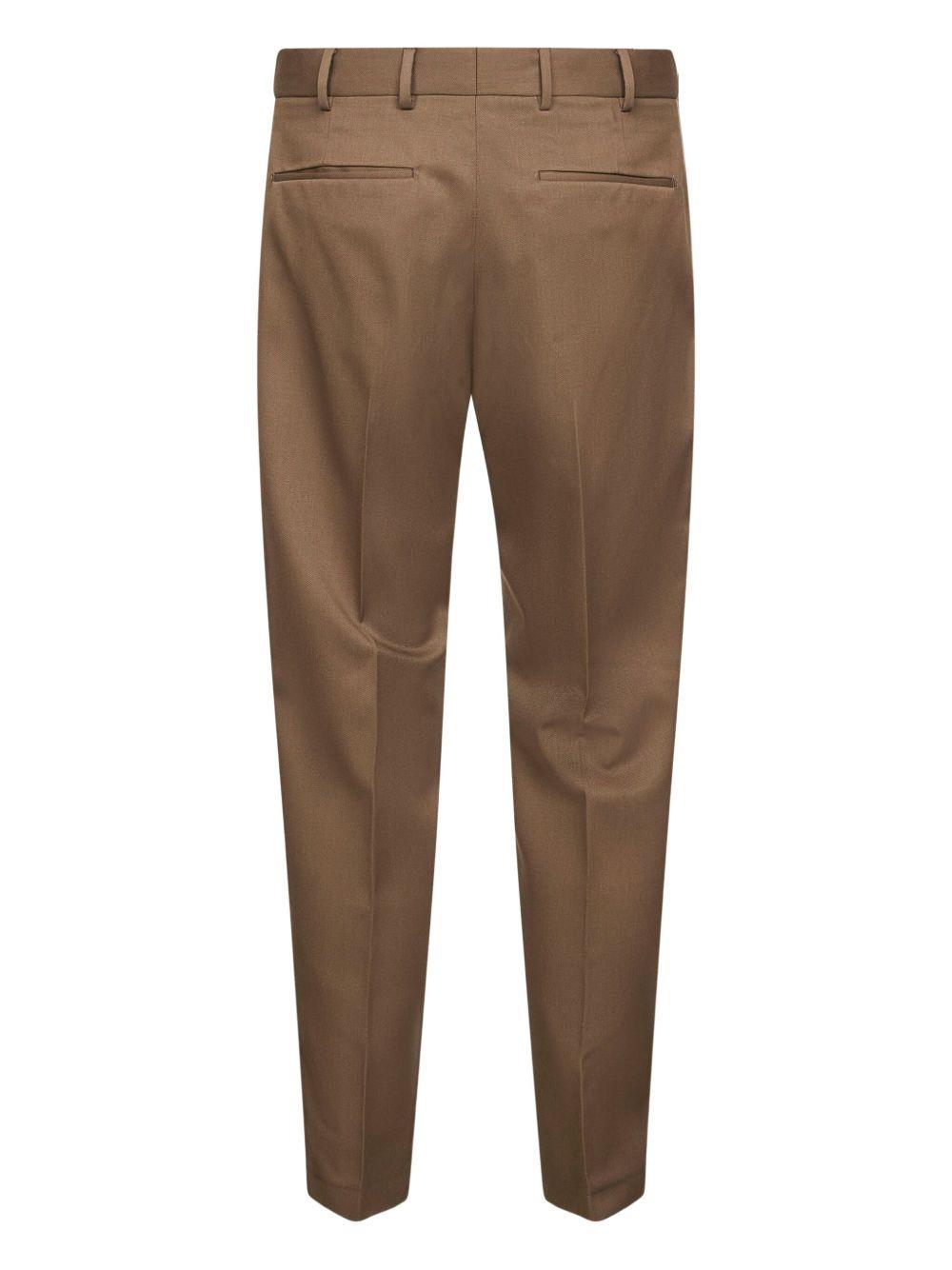 Khaki trousers with crease