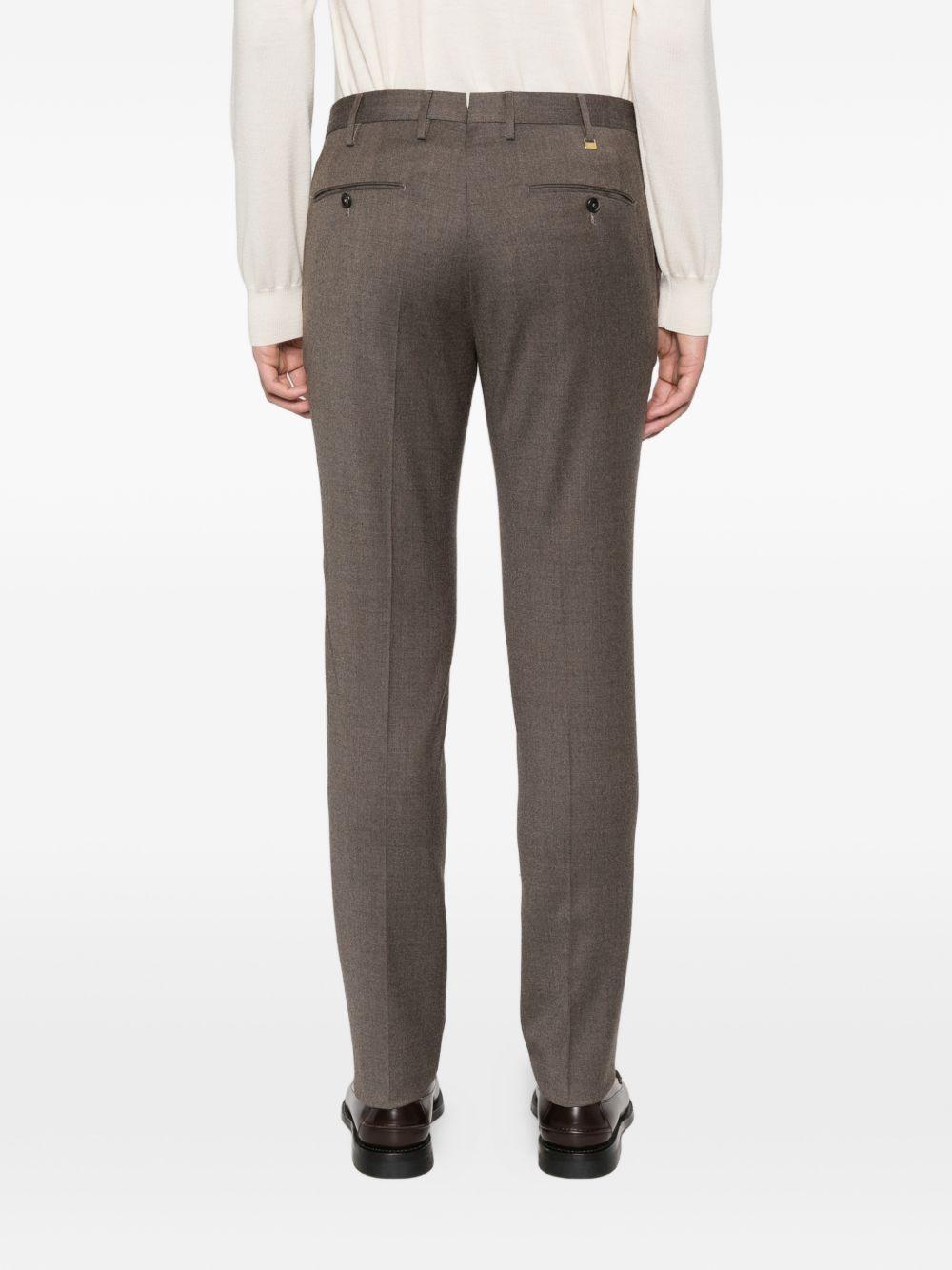 Pantaloni marrone chiaro con tasche 