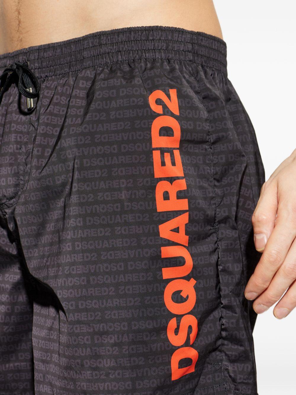 Costume da bagno nero con logo arancione 