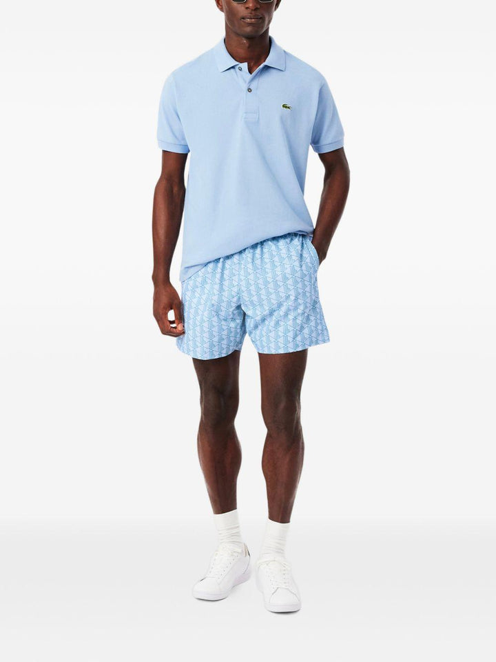 Costume bianco e azzurro con stampa geometrica 