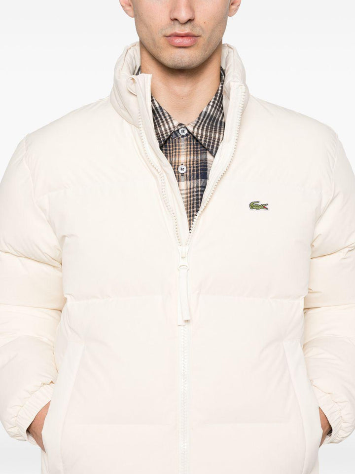 Piumino beige con zip 