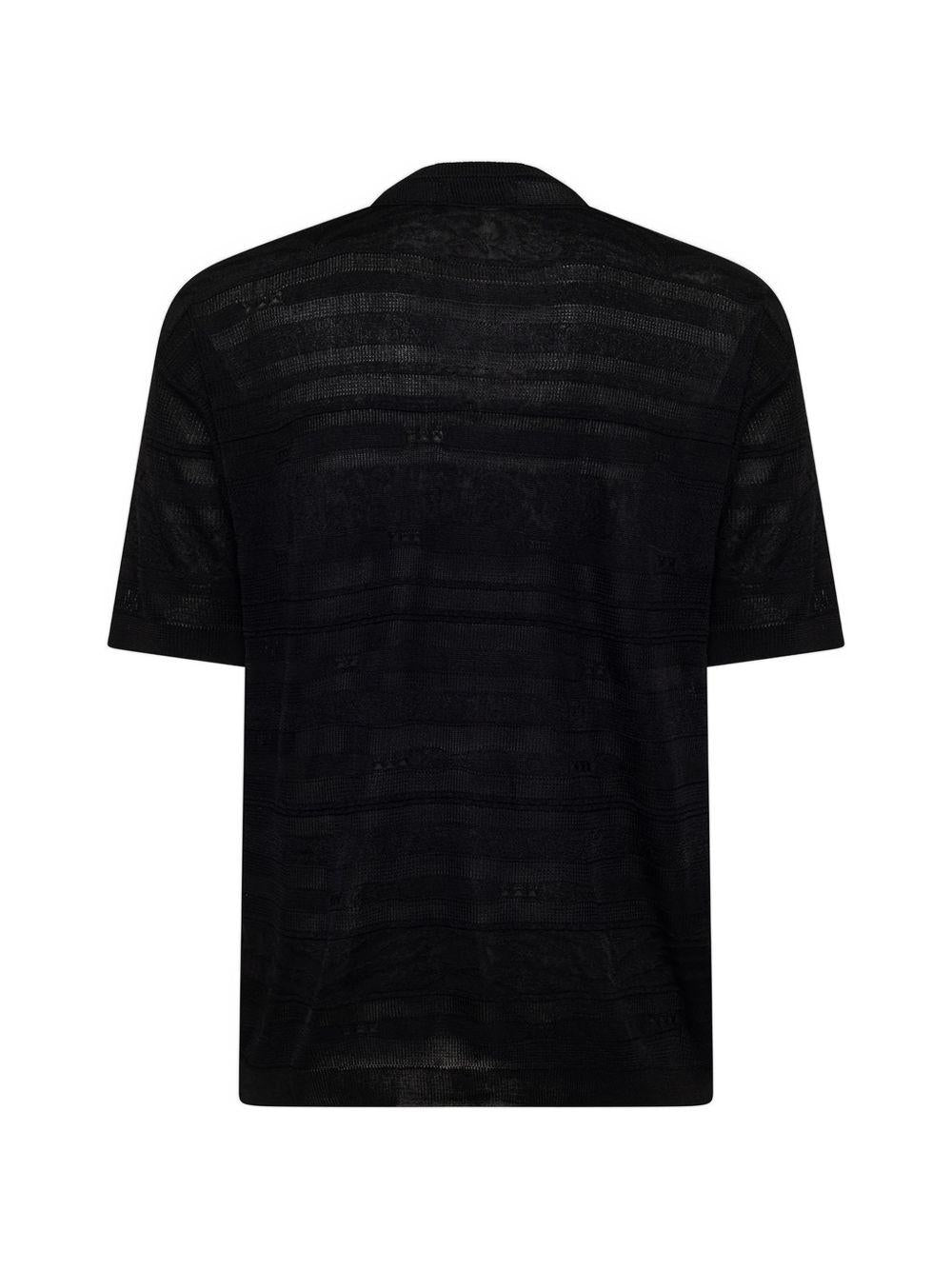T-shirt nera in maglia con trasparenze 