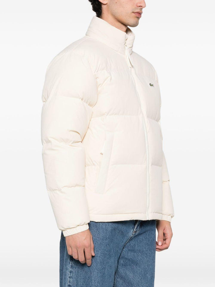 Piumino beige con zip 