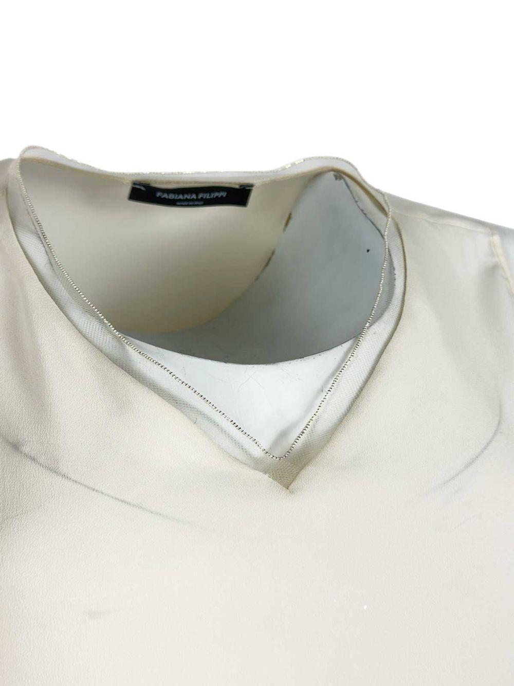 Top smanicato 