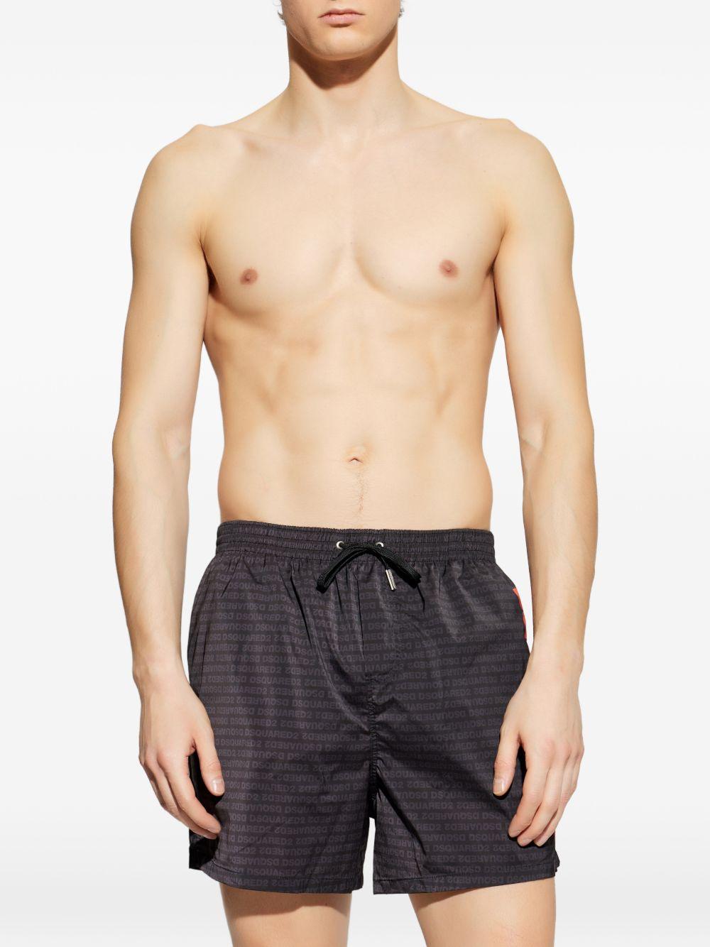 Costume da bagno nero con logo arancione 