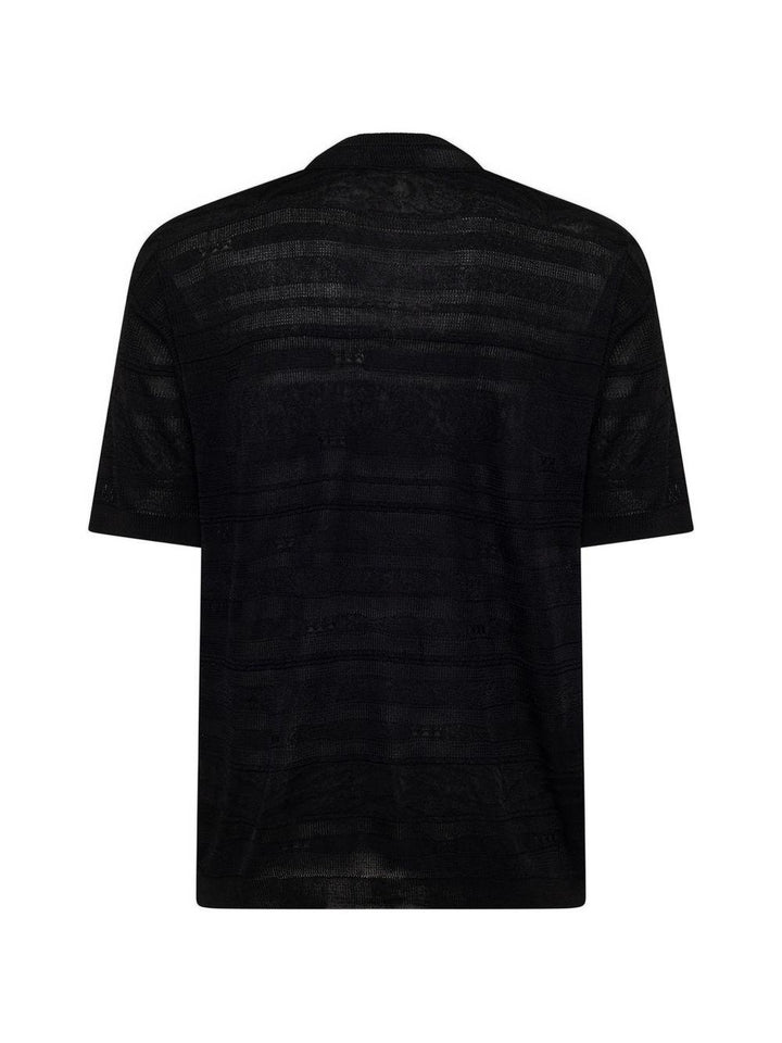T-shirt nera in maglia con trasparenze 