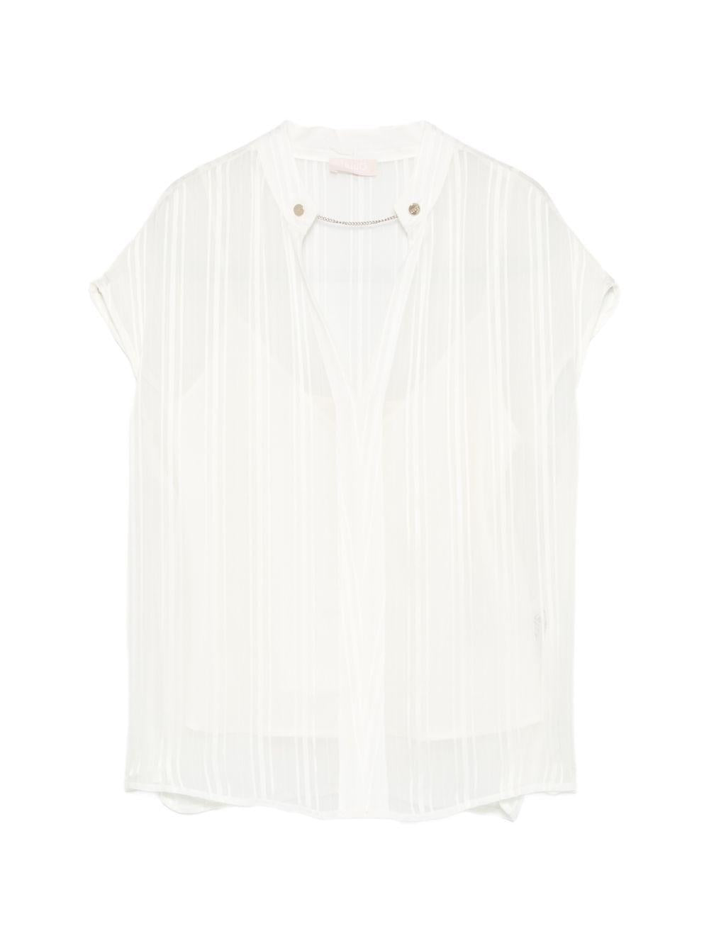 Blusa con scollo a V 