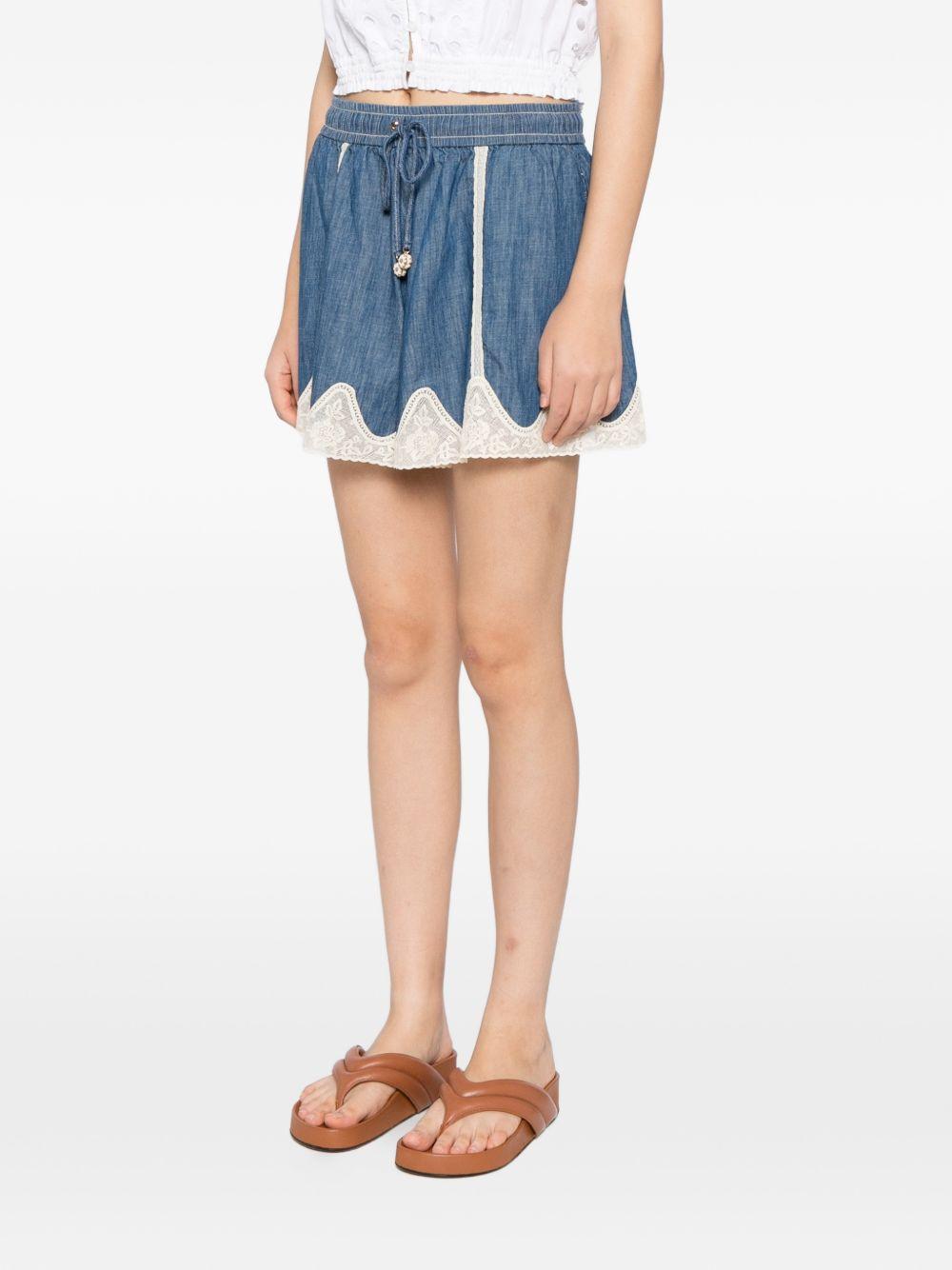 Shorts con inserti 