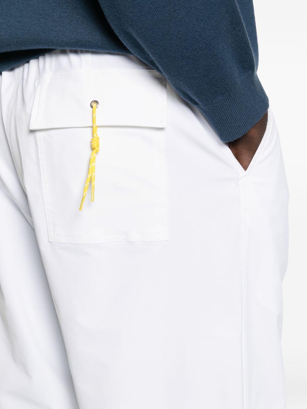 Pantaloni bianchi plissettati con coulisse 