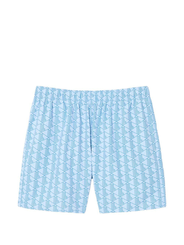 Costume bianco e azzurro con stampa geometrica 