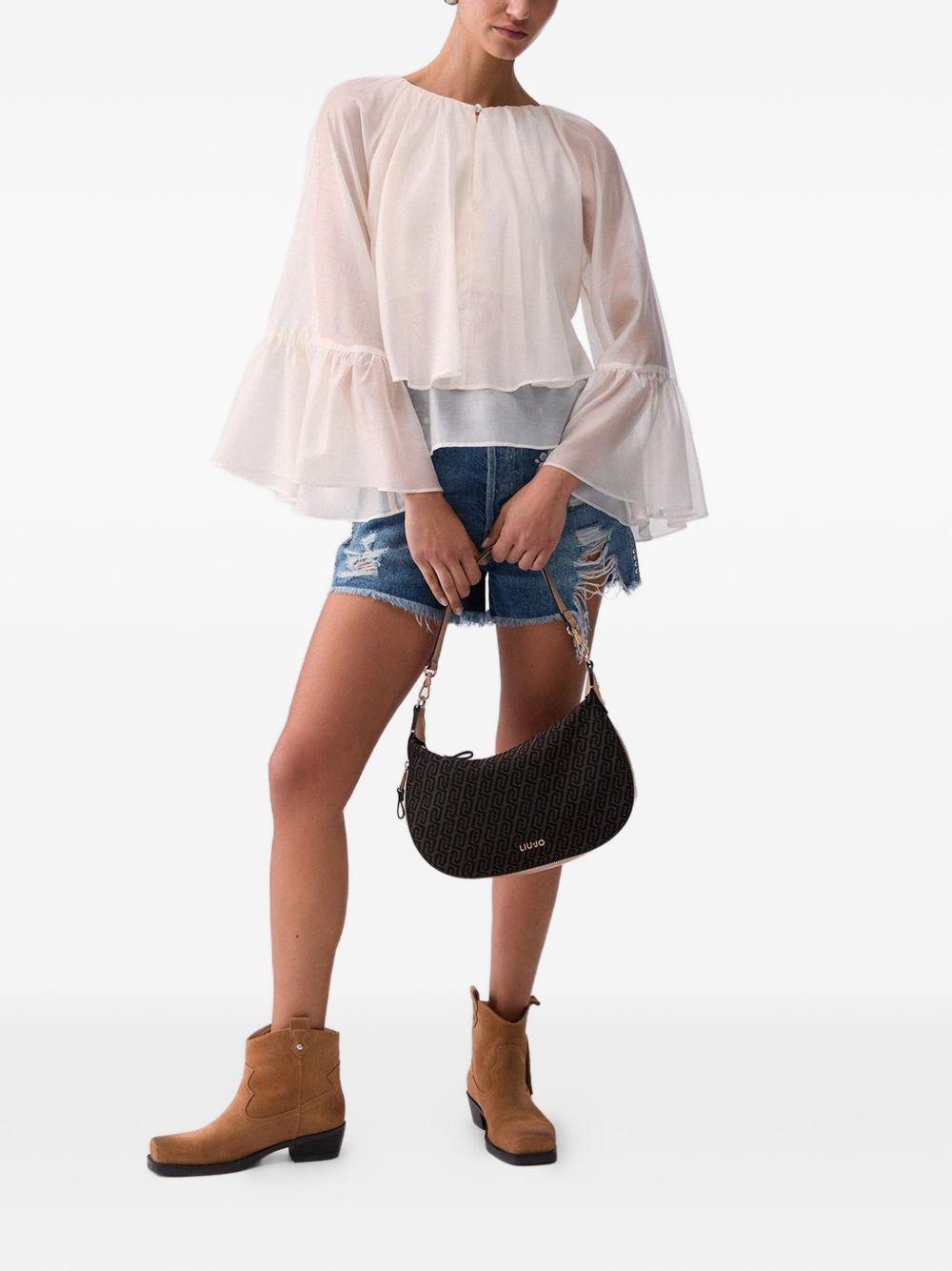 Blusa con maniche ampie 