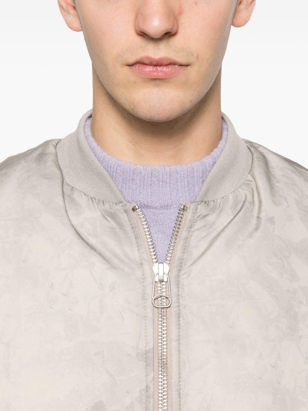Bomber a colori neutri con zip 