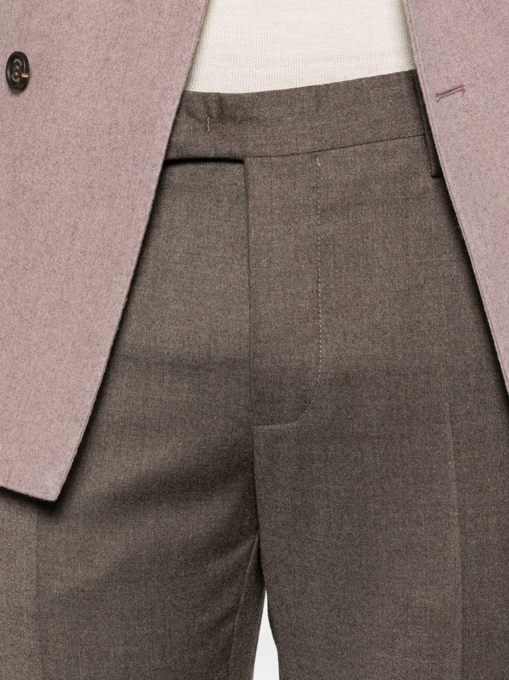 Pantaloni marrone chiaro con tasche 